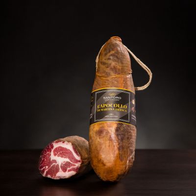 Whole and sliced piece of Capocollo di Martina Franca