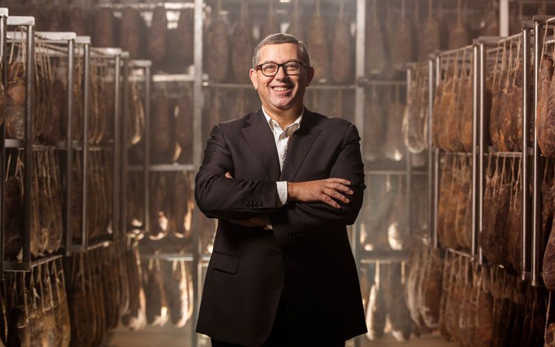 Photo portrait of Giuseppe Santoro in the production center of the salumificio